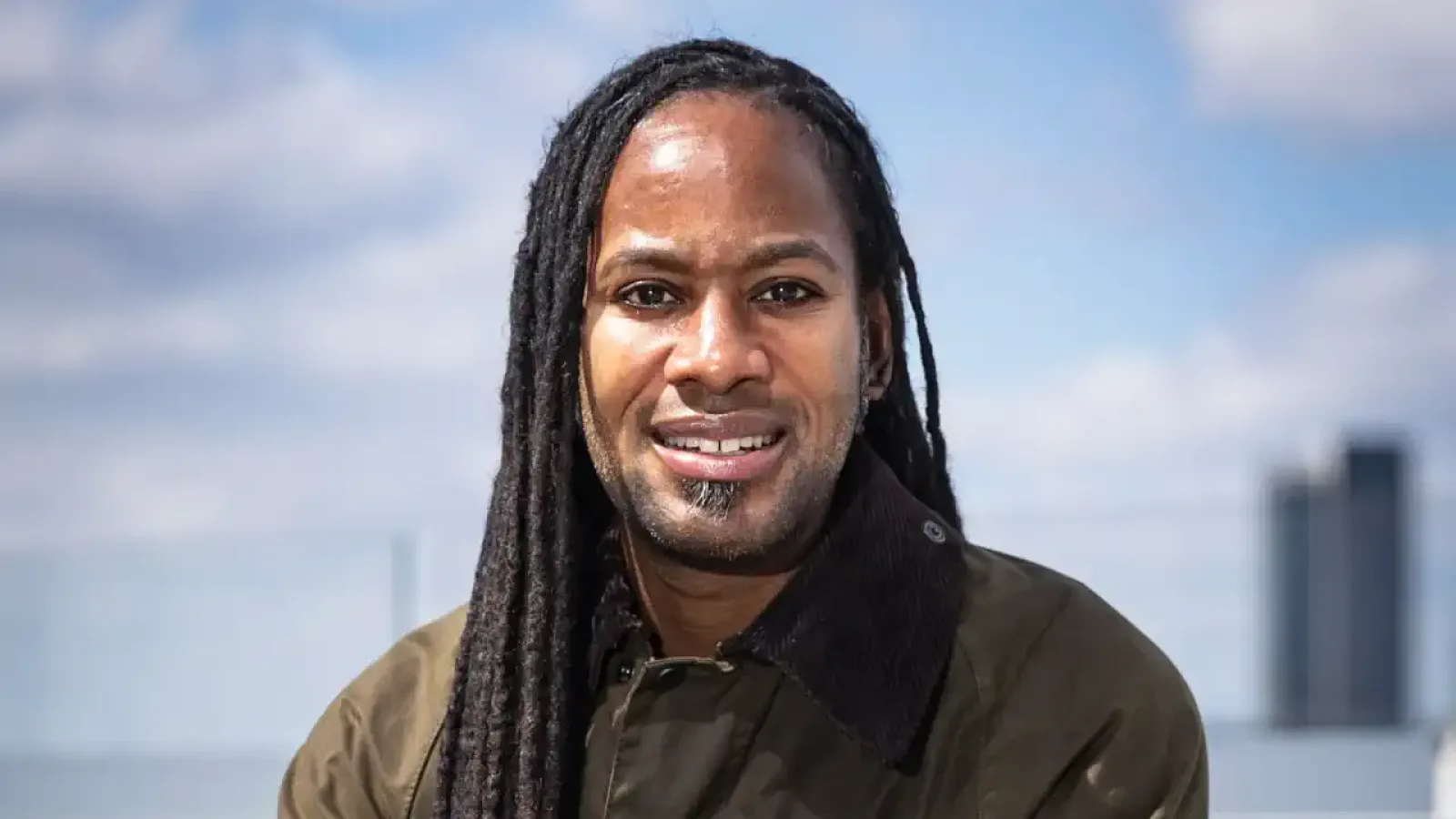 A formal headshot of Professor Jason Arday, a black man with a serious expression, wearing academic attire.