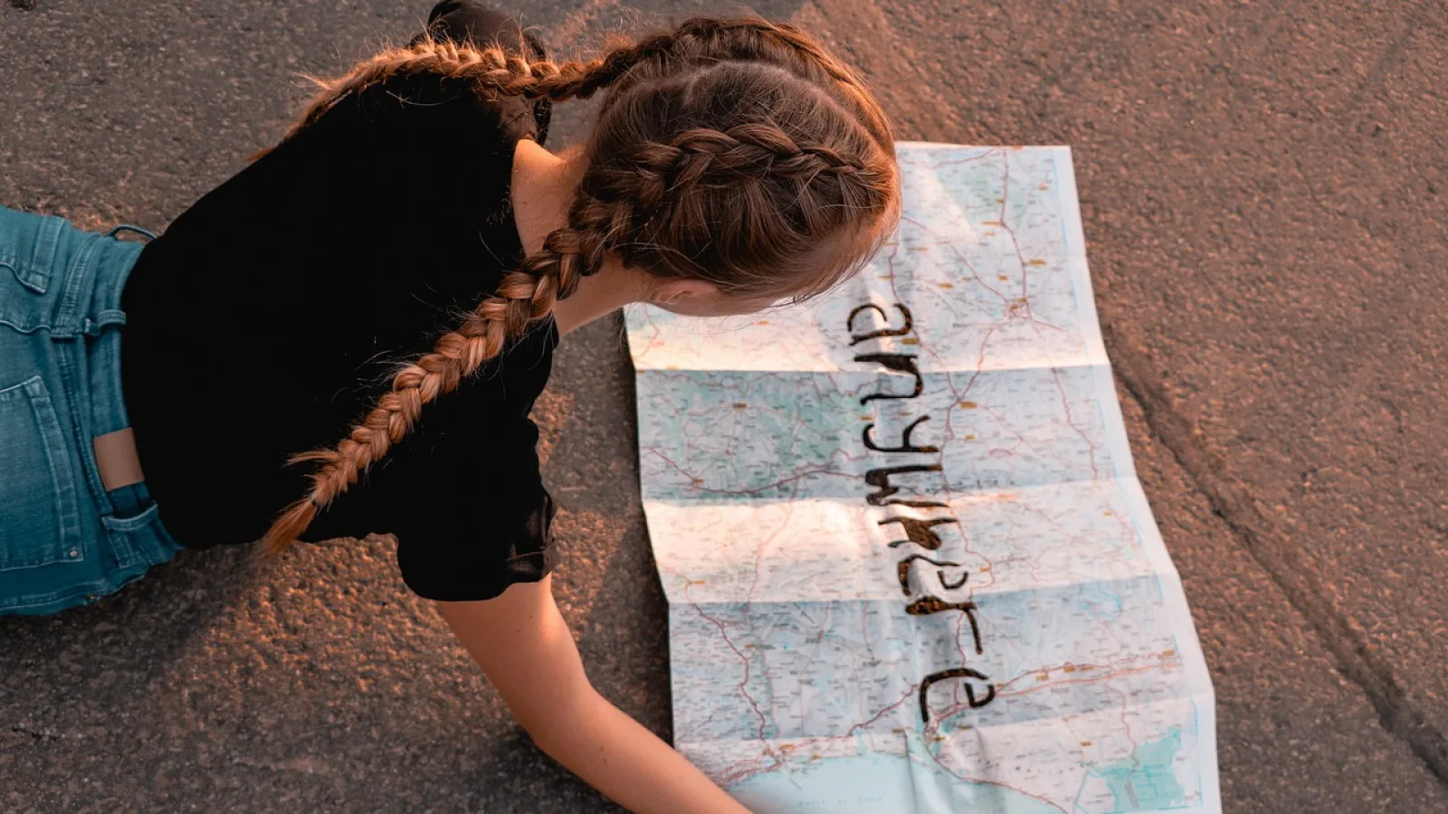 girl looking at map to find ev cargers